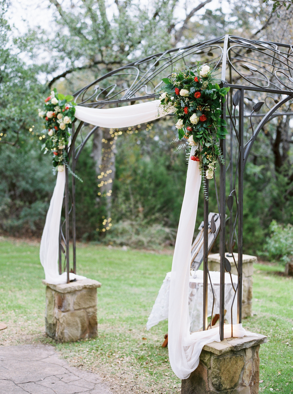 An elegant ceremony arbor is decorated for a winter wedding at a venue in Georgetown, Texas. Photo by Jen Dillender Photography.